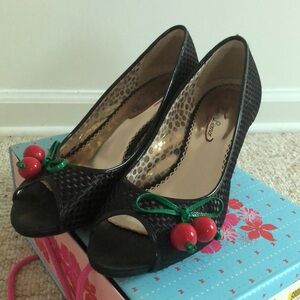 Poetic License Playland’ black basket weave heels with fun cherry detail